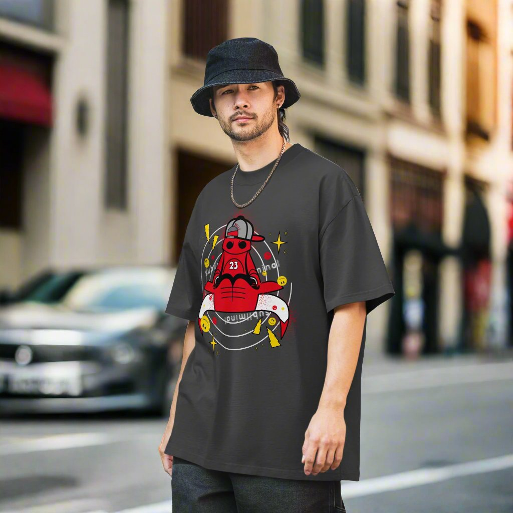 A casual man is standing in an urban environment wearing the Men's Subliminal Bull Cartoon Character Theme Oversized Faded T-shirt.