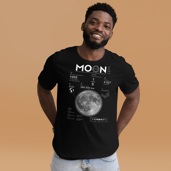 A happy young man is wearing the Men's Moon And Lunar Data Graphic Tee, front view.