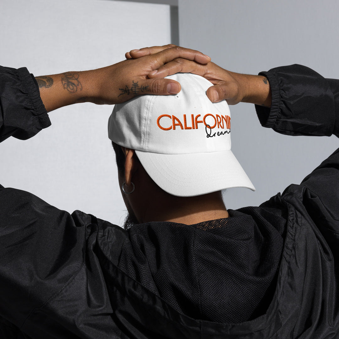 A modern young man is wearing the California Dreamin' Dad Hat, front view.