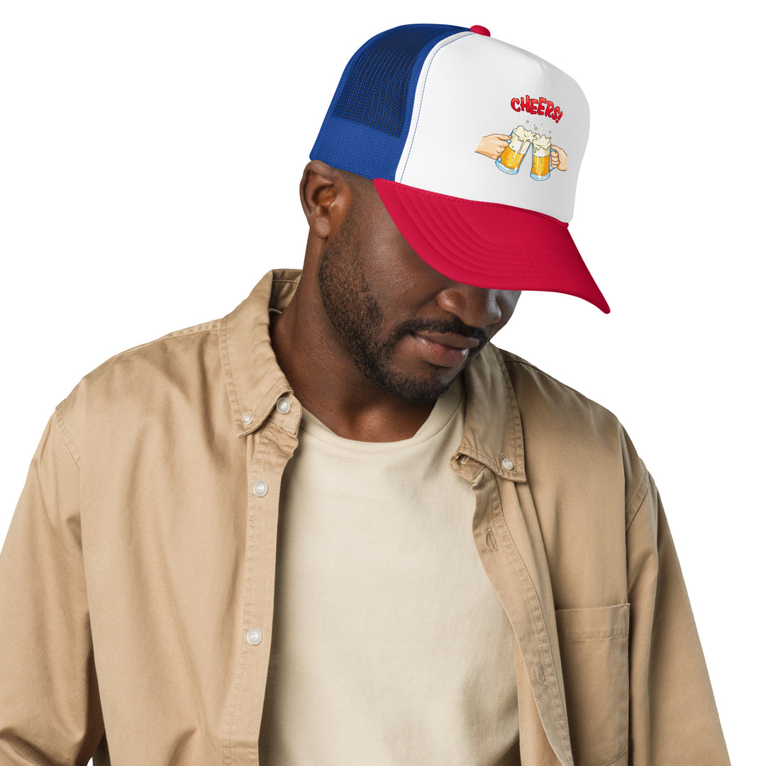 A modern young man is wearing the Two Beers Cheers Foam Trucker Hat, front view.