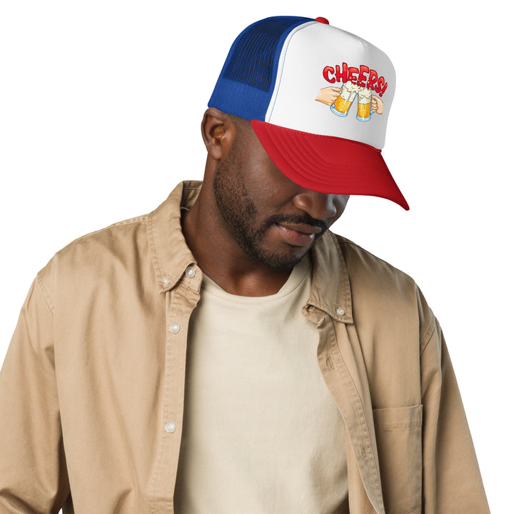 A young man is wearing the Two Beers Cheers Foam Trucker Hat