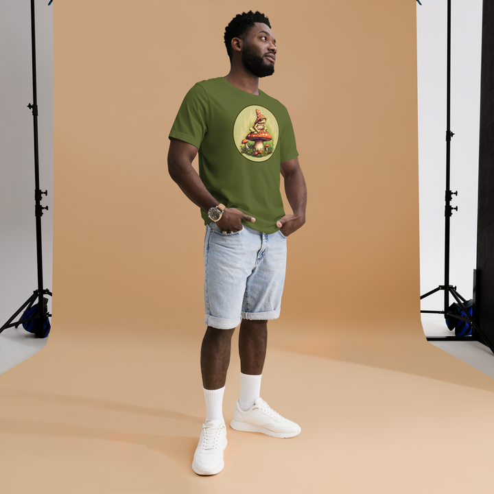A young man with hands in pockets wearing the Men's Frog On A Mushroom Graphic T-shirt, front right angle view.