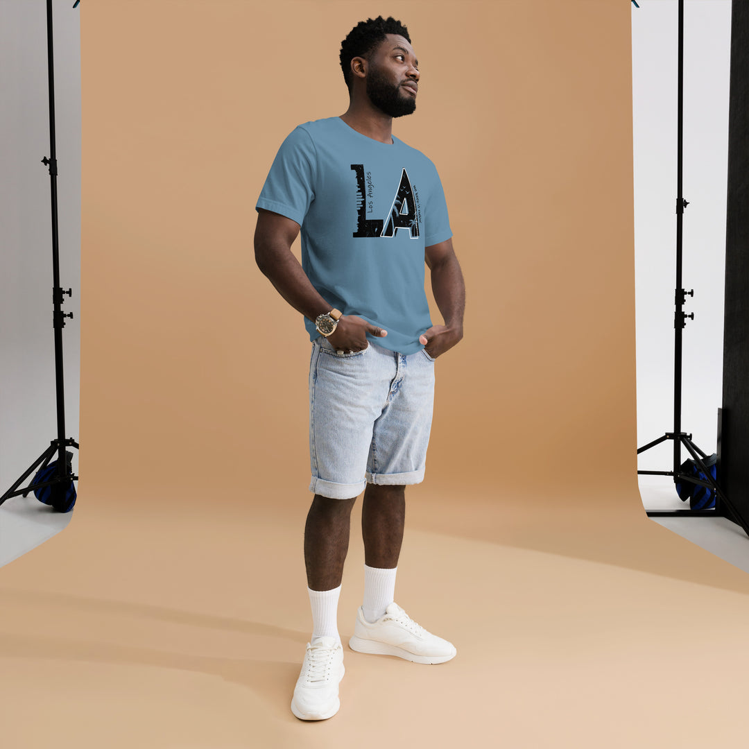 An urban man in the studio is wearing the L.A. City Theme Graphic Tee, full front view.