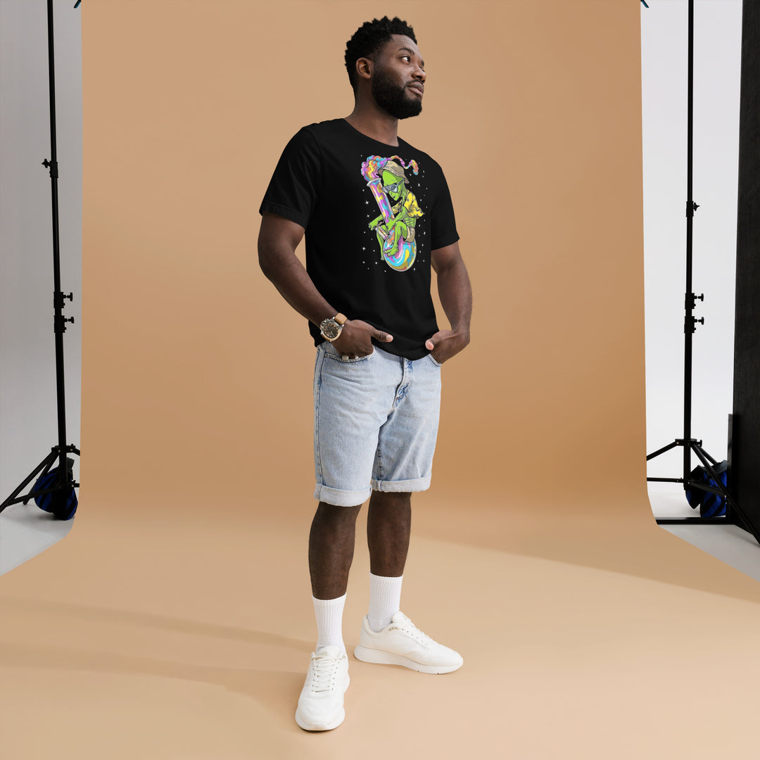 An urban man in the studio is wearing the Men’s Martian And Bong Theme Graphic Tee, front left view.