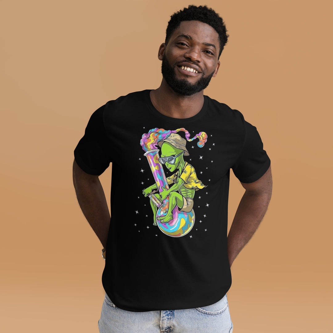 An urban man in the studio is wearing the Men’s Martian And Bong Theme Graphic Tee, front view.