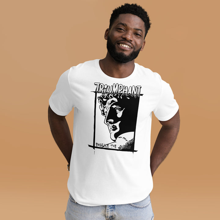 An urban man in the studio is wearing the Triumphant Cartoon Statue Graphic Tee, front view.