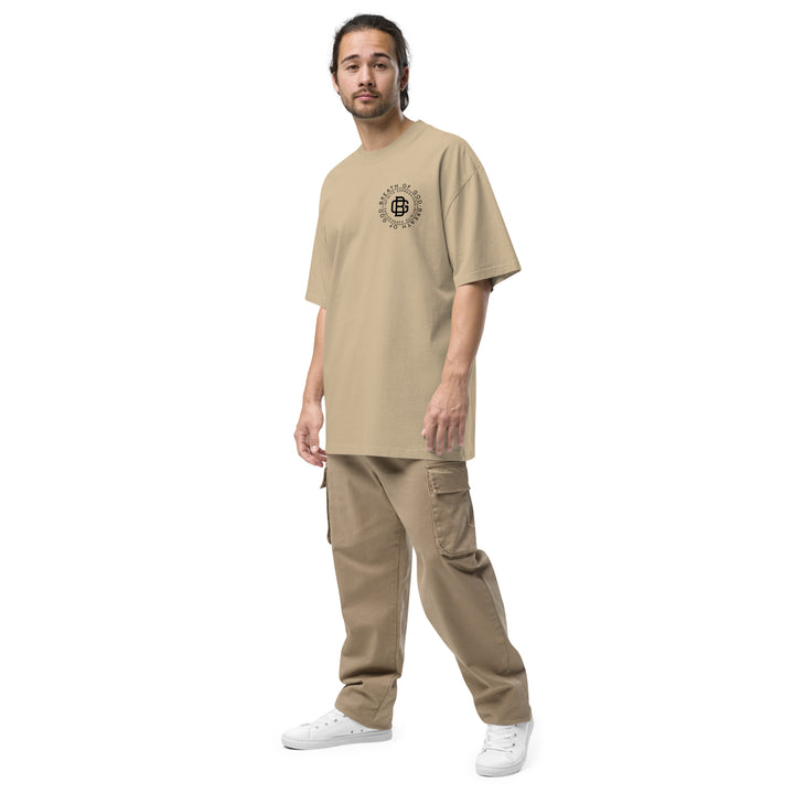 An urban man is wearing the Breath Of God Concept Tee, front left view.