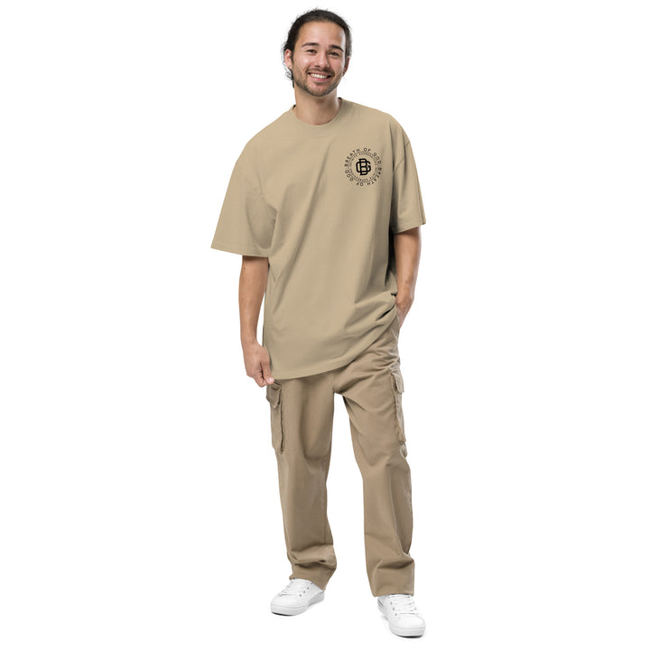 An urban man is wearing the Breath Of God Concept Tee, front view.