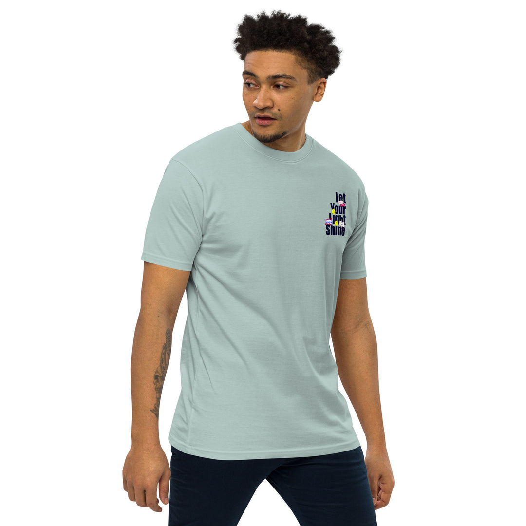 An urban man is wearing the Let Your Light Shine Premium Tee, front right view.