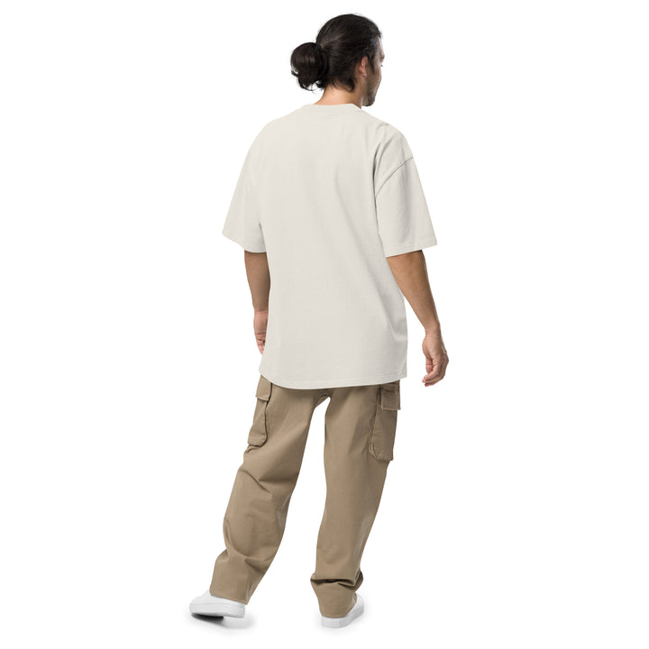 An urban man is wearing the Men's I Own The Streets Theme Oversized Faded Tee, back view.