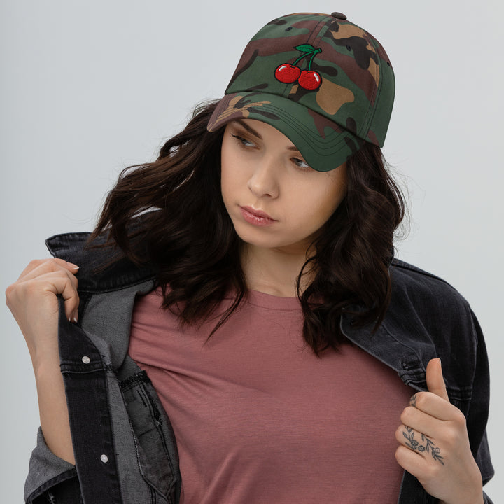 Cherry Bomb Dad Hat in Green Camo — Woman in Jacket Lifestyle Shot