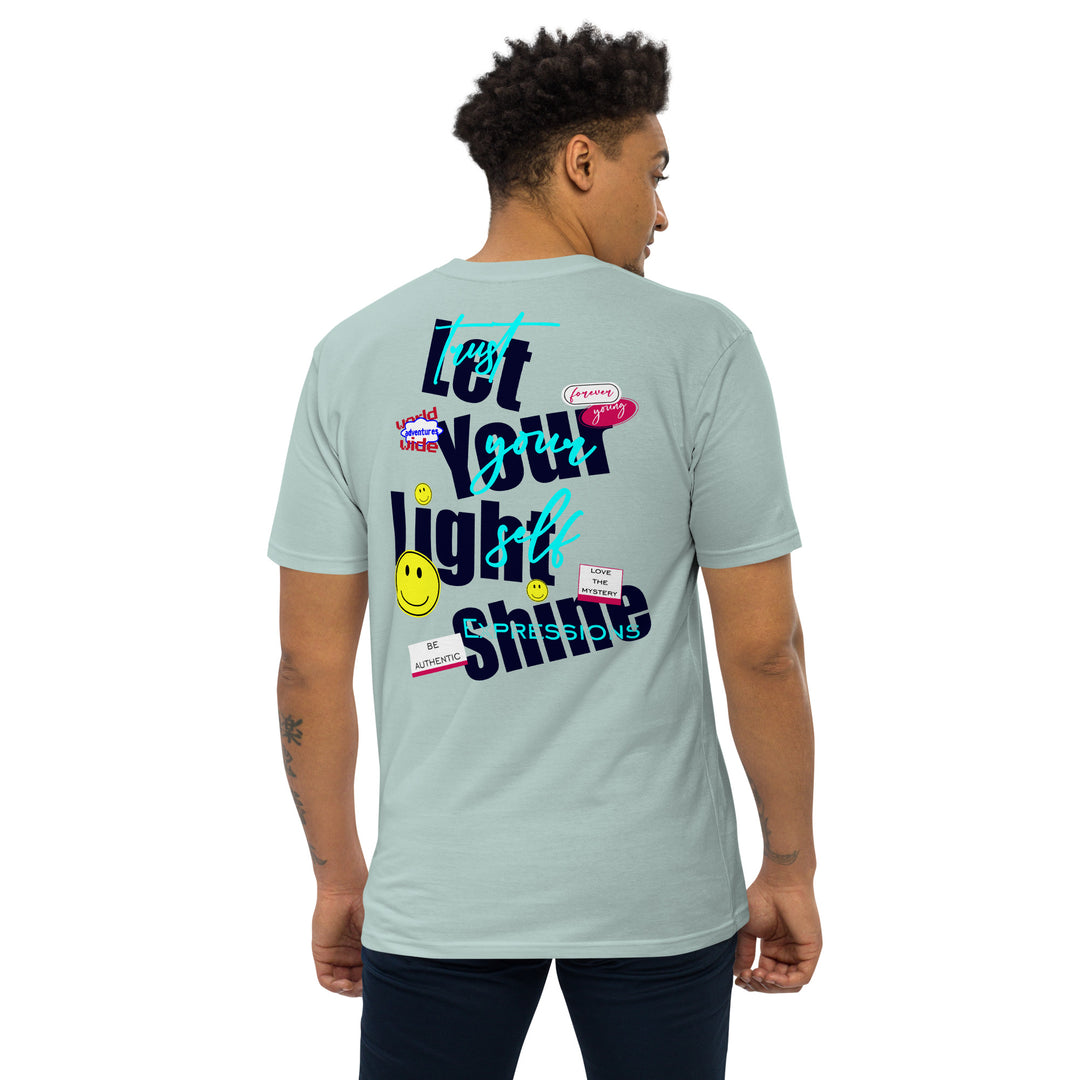 An urban man is wearing the Men’s Let Your Light Shine Premium Tee, back view.